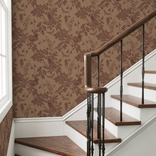 Western Birds and Flowers wallpaper in Buckskin styled in a stairway interior — saddle brown wallpaper by Pine + Feather Studio