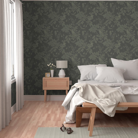 Western Birds and Flowers wallpaper in Pine Shadow styled in a bedroom interior — earthy green wallpaper by Pine + Feather Studio