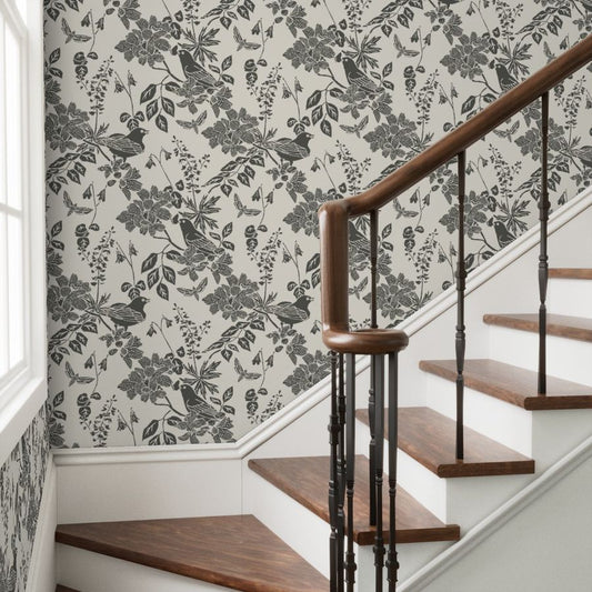 Western Birds and Flowers wallpaper in Winter Moss styled in a entry way stairwell room interior — parchment wallpaper by Pine + Feather Studio