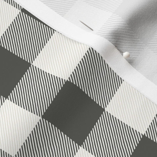 Close-up of the Cabin Check buffalo check fabric in Charcoal on cotton sateen, showing the drawn twill texture