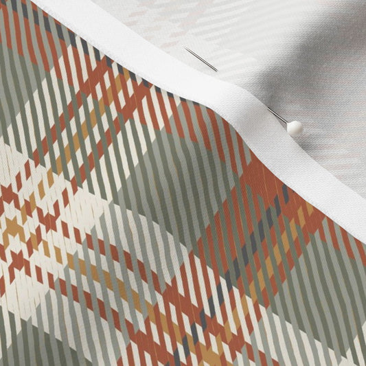 Close-up of the Homestead Plaid fabric in Autumn Spice on cotton sateen, showing the rust, sage and cream tartan and the fabric's smooth weave