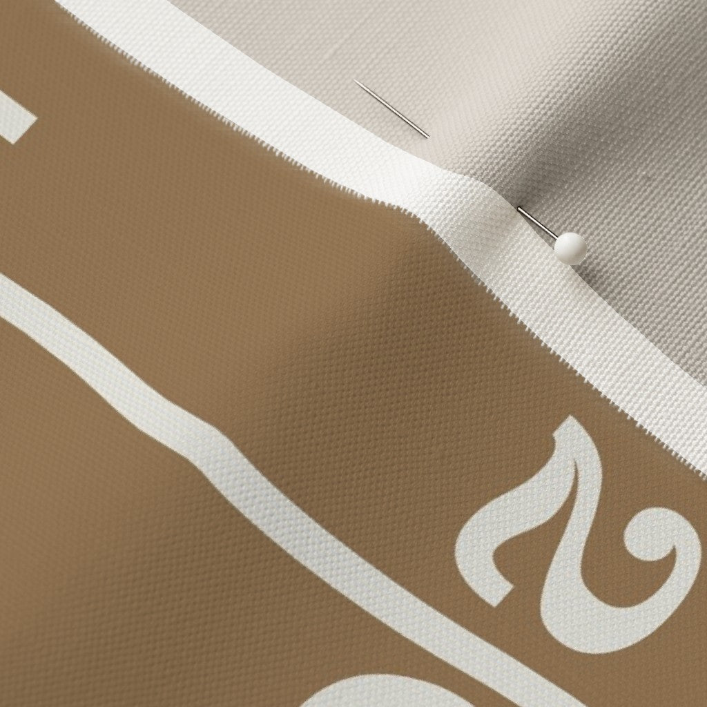gold linen lumbar pillow cover fabric detail showing football field yard lines and numbers — linen canvas pillow texture close-up