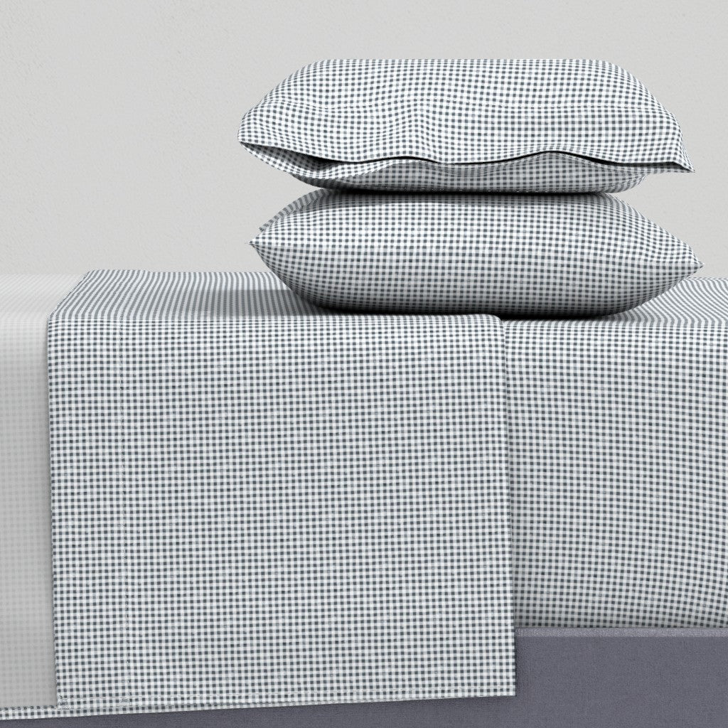 navy and white gingham sheet set flat lay showing pillowcase flat sheet and fitted sheet — cotton sateen gingham bed sheets