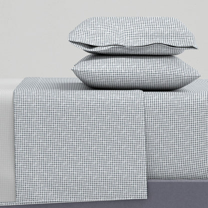 navy and white gingham sheet set flat lay showing pillowcase flat sheet and fitted sheet — cotton sateen gingham bed sheets