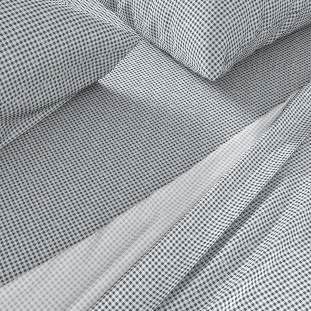 navy gingham sheets close-up showing small-scale Gridiron Gingham check pattern on cotton sateen pillowcase and fitted sheet