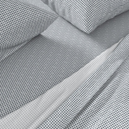 navy gingham sheets close-up showing small-scale Gridiron Gingham check pattern on cotton sateen pillowcase and fitted sheet