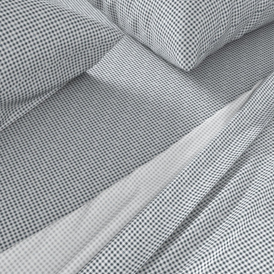 navy gingham sheets close-up showing small-scale Gridiron Gingham check pattern on cotton sateen pillowcase and fitted sheet