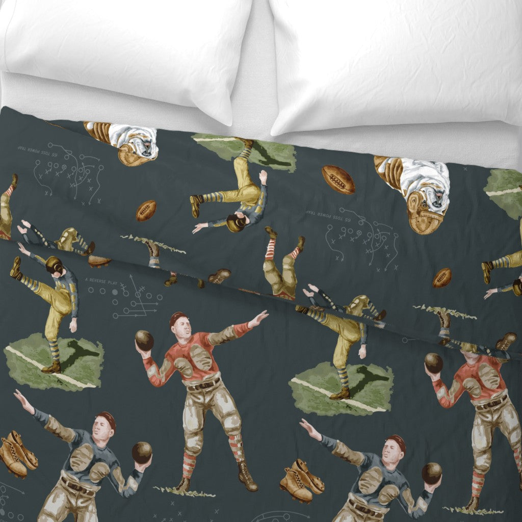 vintage football bedding close-up showing hand-illustrated 1920s players and English bulldog mascot on dark slate