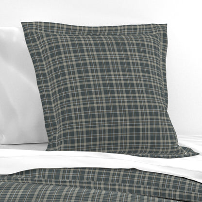 Touchdown Tartan cotton pillow sham styled on a bed — dark plaid pillow sham in flanged euro size with dark slate tartan