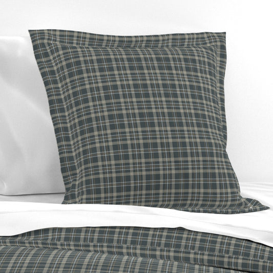 Touchdown Tartan cotton pillow sham styled on a bed — dark plaid pillow sham in flanged euro size with dark slate tartan