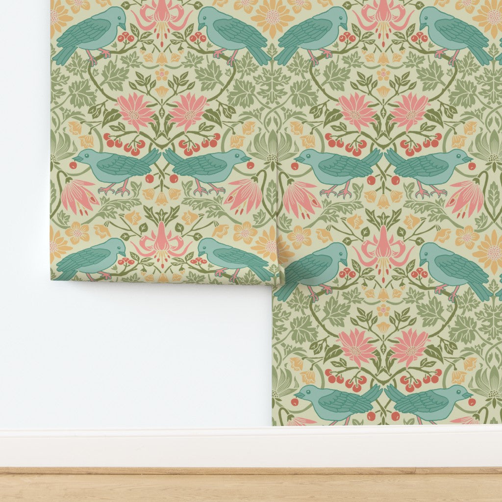 Huckleberry Thief wallpaper in Spring Thaw hung on a wall: duck-egg bluebirds with madder rose and weld yellow florals in a mirrored Arts and Crafts pattern on a light green ground