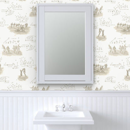 Antique sepia football wallpaper above white beadboard in a classic bathroom with pedestal sink — vintage americana wallpaper for powder rooms