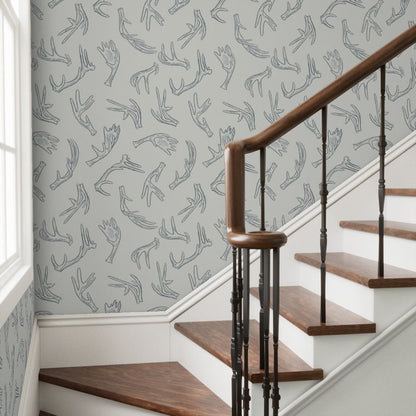 Morning Frost antler wallpaper styled in a stairway hallway transitional interior — Pine + Feather Studio