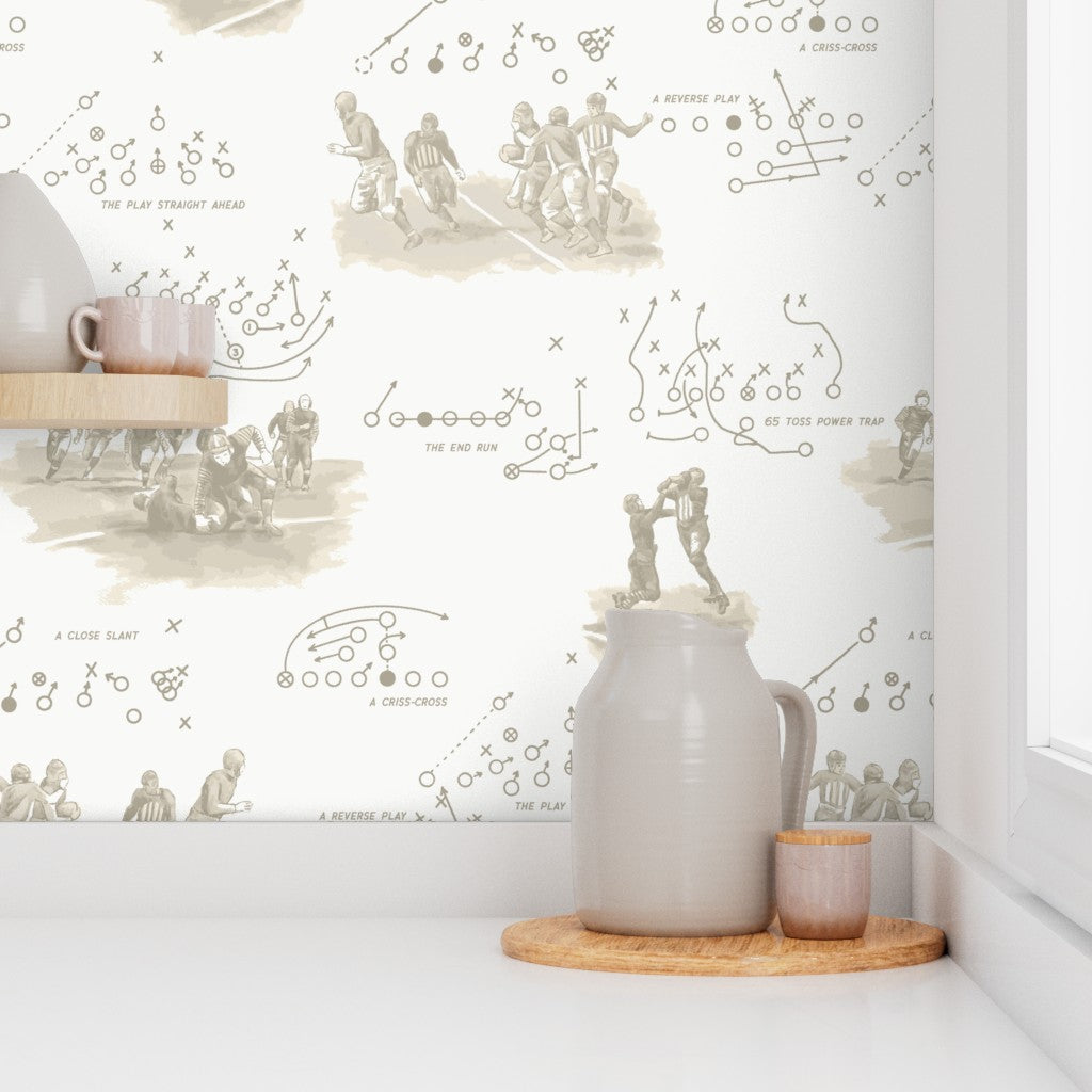 Vintage sepia playbook wallpaper in a kitchen with ceramic and wood accessories — old football wallpaper for kitchens and casual dining spaces