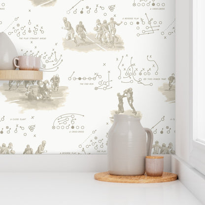 Vintage sepia playbook wallpaper in a kitchen with ceramic and wood accessories — old football wallpaper for kitchens and casual dining spaces