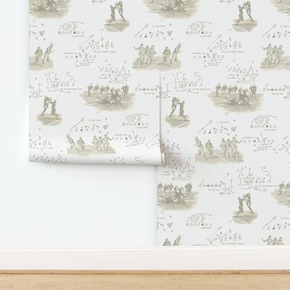 Vintage football wallpaper in warm sepia featuring hand-illustrated 1920s players and period play diagrams on soft off-white