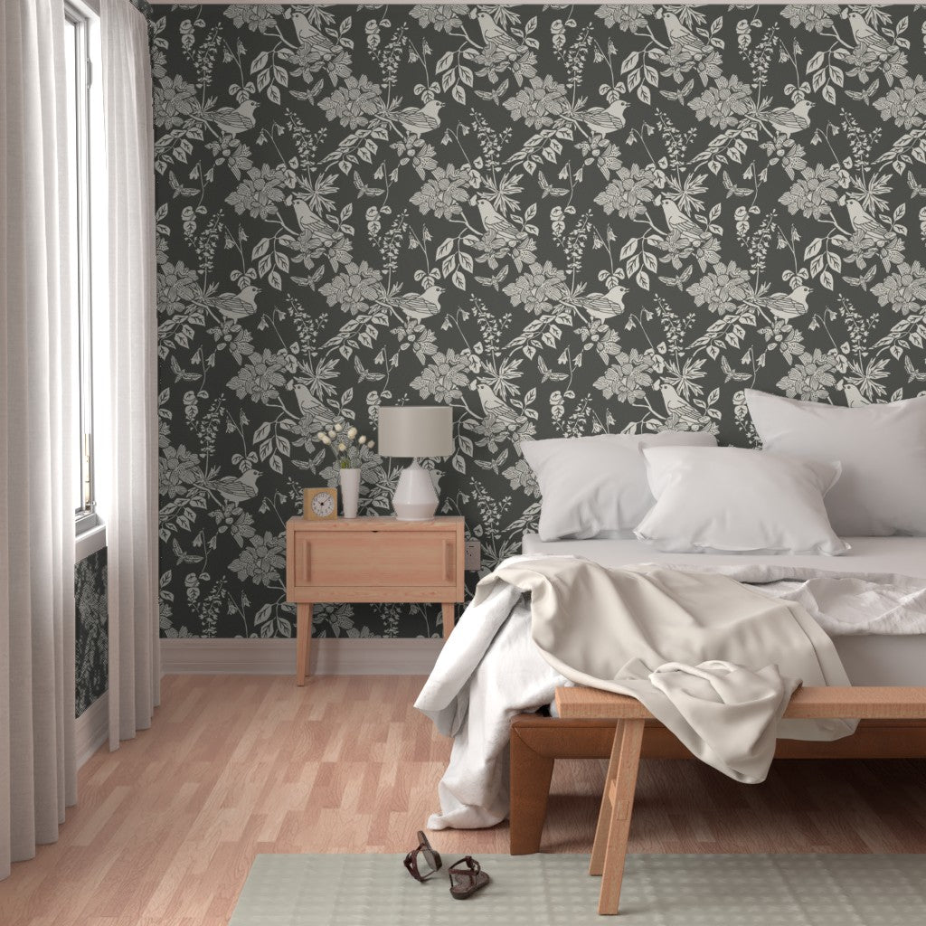 Western Birds and Flowers wallpaper in Forest Frost styled in a bedroom interior — dark botanical wallpaper by Pine + Feather Studio