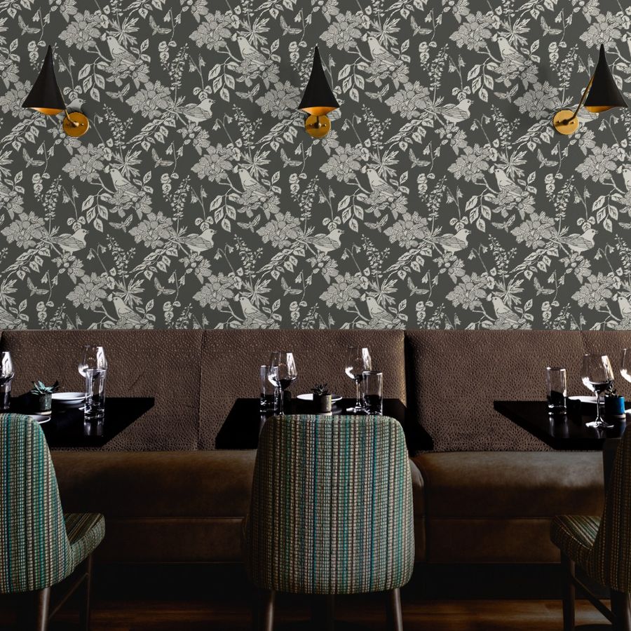 Western Birds and Flowers wallpaper in Forest Frost styled in a restaurant hospitality interior — dark botanical wallpaper by Pine + Feather Studio