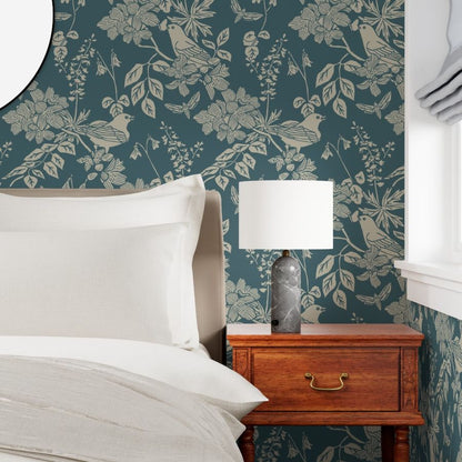 Western Birds and Flowers wallpaper in Jewel Canyon styled in a bedroom accent wall interior — dark teal wallpaper by Pine + Feather Studio