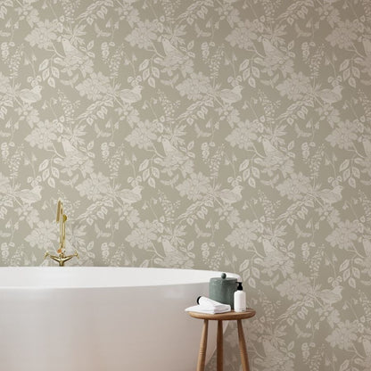 Western Birds and Flowers wallpaper in Pale Rain styled in a bathroom interior — creamy white wallpaper by Pine + Feather Studio