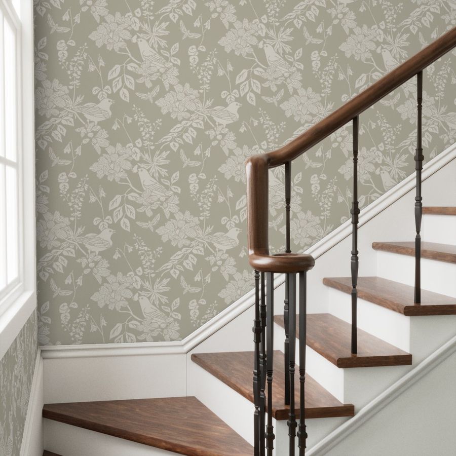 Western Birds and Flowers wallpaper in Pale Rain styled in a transitional stairwell room interior — creamy white wallpaper by Pine + Feather Studio