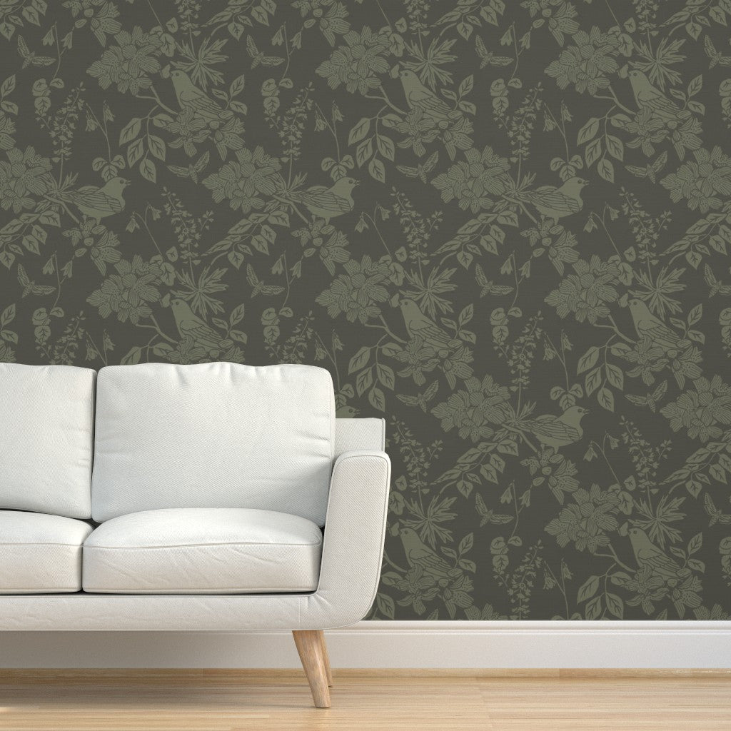 Western Birds and Flowers wallpaper in Pine Shadow styled in a living room interior — earthy green wallpaper by Pine + Feather Studio