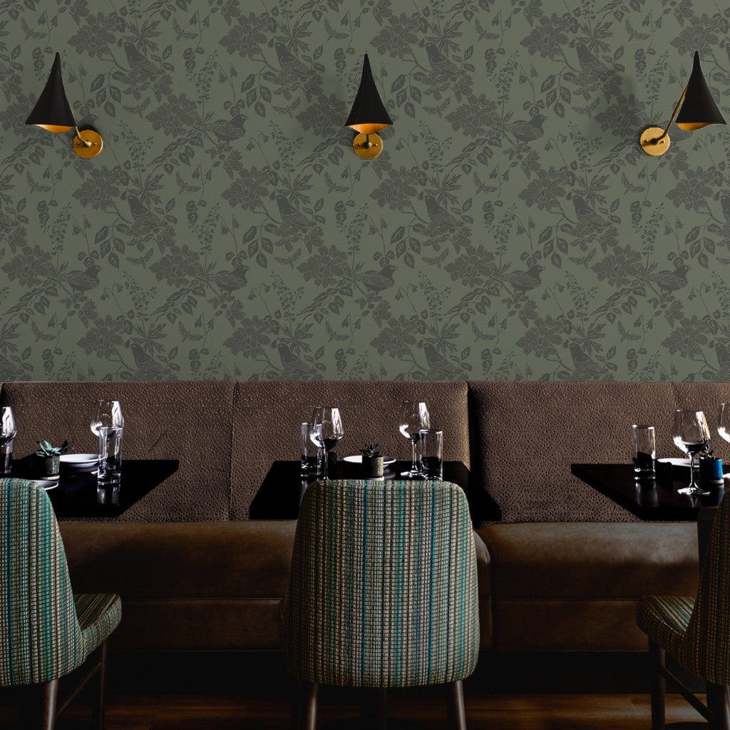 Western Birds and Flowers wallpaper in Deep Moss styled in a hospitality restaurant room interior — arts and crafts bird wallpaper by Pine + Feather Studio