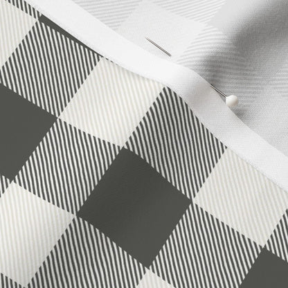 Close-up of the Cabin Check buffalo check fabric in Charcoal on cotton sateen, showing the drawn twill texture