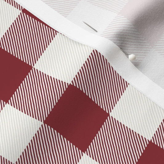 Close-up of the Cabin Check buffalo check fabric in Cranberry Red on cotton sateen, showing the drawn twill texture