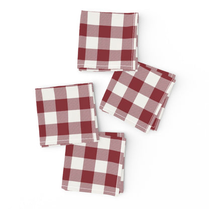 Cabin Check dinner napkins in Cranberry Red, a red and cream buffalo check, folded on a white background