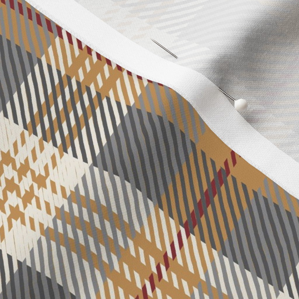 Close-up of the Homestead Plaid fabric in Winter Hearth on cotton sateen, showing the charcoal and golden mustard tartan and the fabric's smooth weave