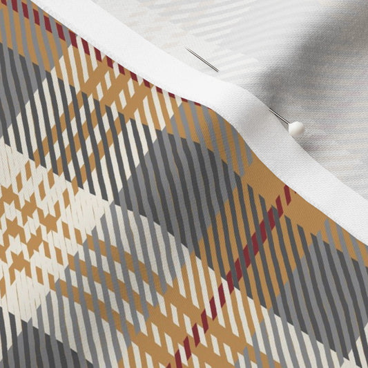 Close-up of the Homestead Plaid fabric in Winter Hearth on cotton sateen, showing the charcoal and golden mustard tartan and the fabric's smooth weave